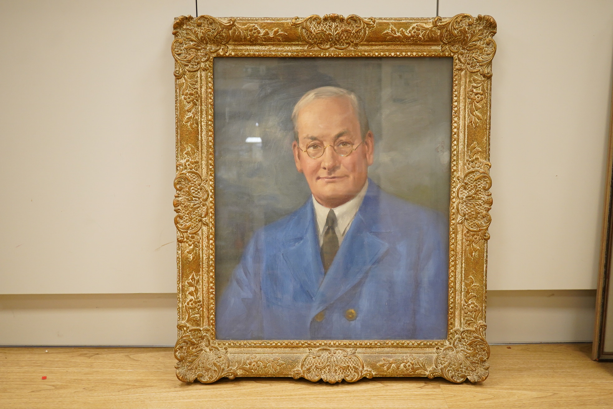 Modern British, oil on canvas, Head and shoulders portrait of a gentleman wearing spectacles, unsigned, 59 x 49cm, ornate gilt frame. Condition - good